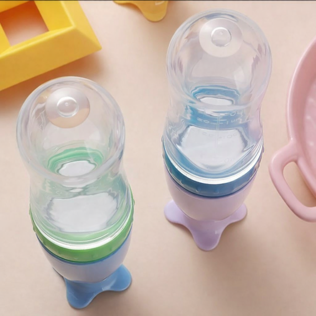 Tetero con cuchara para bebé en silicona